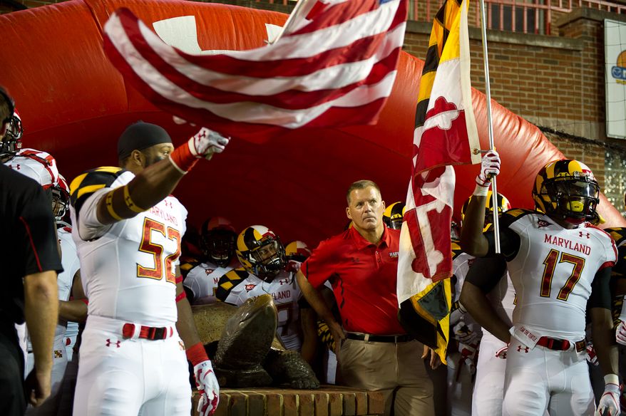 Head coach Randy Edsall, center, of the Maryland Terrapins waits with his team to take the field before the start of the game at Byrd Stadium at the University of Maryland, on Monday September 5, 2011. (Andrew Harnik / The Washington Times)