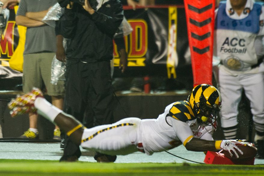 Wide receiver Ronnie Tyler (#4) of the Maryland Terrapins scores the first touchdown of the game against Miami in the first quarter at Byrd Stadium at the University of Maryland, on Monday September 5, 2011. (Andrew Harnik / The Washington Times)