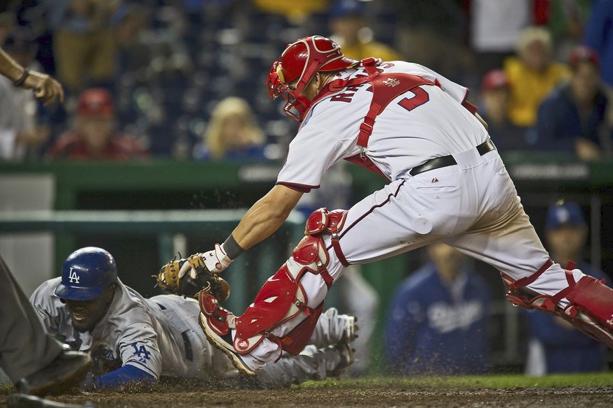 Nationals catcher Wilson Ramos, tagging out the Los Angeles' Dodgers' Tony Gwynn, Jr., on Tuesday, is hitting .294 since Aug. 1. The rookie is batting .261 with 12 home runs and 43 RBI. (Rod Lamkey Jr./The Washington Times)