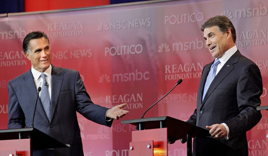 PARTY POLITICS: Former Massachusetts Gov. Mitt Romney (left) and Texas Gov. Rick Perry spar during a Wednesday debate held at the Reagan Library in Simi Valley, Calif., among eight Republicans seeking the 2012 GOP presidential nod. (Associated Press)