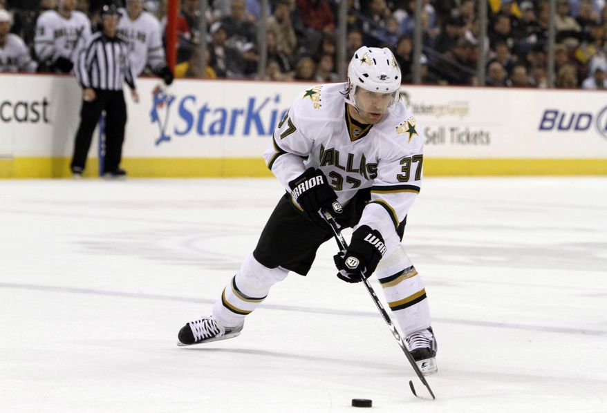 ** FILE ** Karlis Skrastins of Latvia, then with the Dallas Stars, controls the puck during an the NHL hockey game against the Pittsburgh Penguins in Pittsburgh in March 2010. A Russian jet carrying a top ice hockey team crashed just after takeoff on Wednesday, Sept. 7, 2011, killing at least 43 people, including Skrastins. (AP Photo/Keith Srakocic, File)