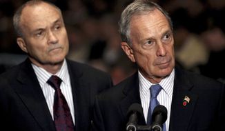 ** FILE ** New York Mayor Michael Bloomberg (right) and New York Police Commissioner Raymond Kelly take a question after ceremonies swearing in new police recruits in New York in July 2010. (AP Photo/Craig Ruttle, File)