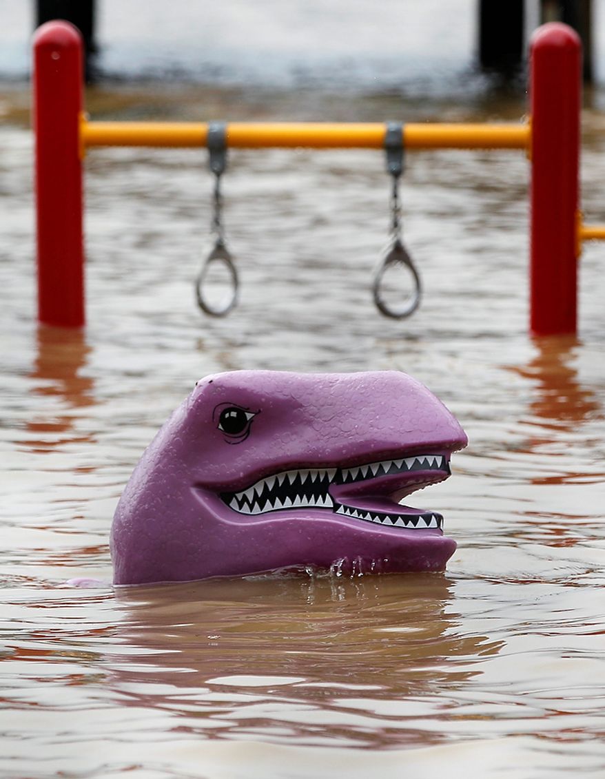 Playground equipment is seen partially submerged in Port Deposit, Md., Thursday, Sept. 8, 2011, as rainfall from the remnants of Tropical Storm Lee causes flooding along the East Coast.The National Weather Service predicted rain would continue to fall heavily across the mid-Atlantic and Northeastern states through Thursday with anywhere from 4 to 7 more inches falling and up to 10 inches in isolated pockets. Flood watches and warnings were in effect from Maryland to New England. (AP Photo/Patrick Semansky)