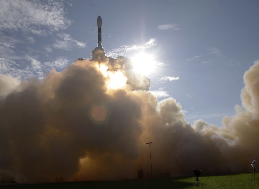 A Delta II rocket, carrying the Gravity Recovery and Interior Laboratory (GRAIL) mission, lifts off from the Cape Canaveral Air Force Station in Cape Canaveral, Fla., Saturday, Sept. 10, 2011. The objective of the mission is to determine the structure of the lunar interior. (AP Photo/John Raoux)