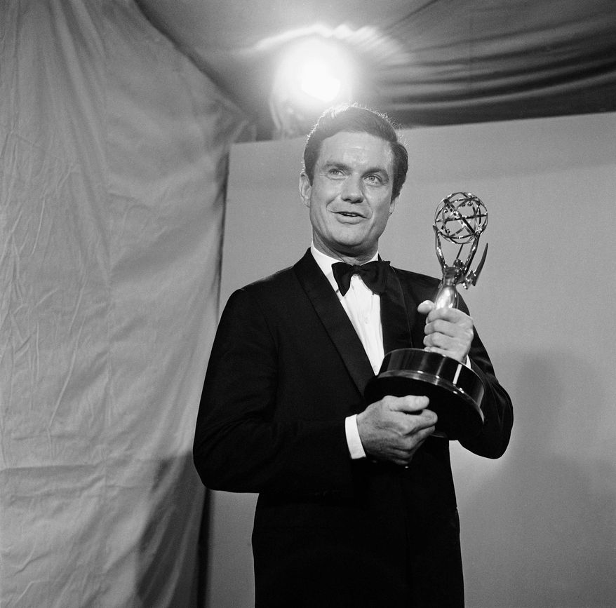 ** FILE ** In this May 22, 1966, file photo, actor Cliff Robertson holds the Emmy he won for the outstanding single performance by an actor in a leading role in a drama at the 18th annual Television Academy Awards in the Hollywood section of Los Angeles. Robertson died Saturday, Sept. 10, 2011. He was 88. (AP Photo)