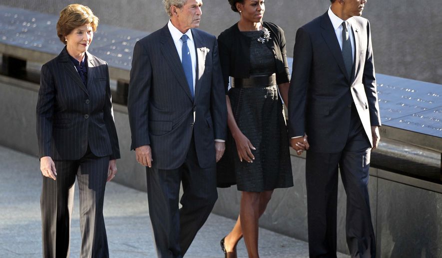 President Obama (from right), first lady Michelle Obama, former President George W. Bush and former first lady Laura Bush visit the North Memorial Pond at the National Sept. 11th Memorial on Sunday, Sept., 11, 2011, in New York. (AP Photo/Pablo Martinez Monsivais) ** FILE **