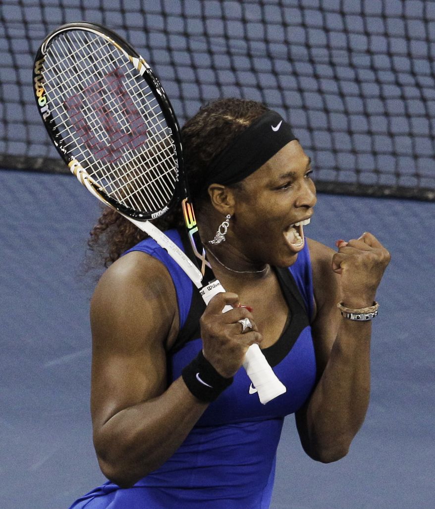 Serena Williams reacts after winning her semifinal match against Caroline Wozniacki of Denmark at the U.S. Open in New York on Saturday, Sept. 10, 2011. (AP Photo/Charlie Riedel)