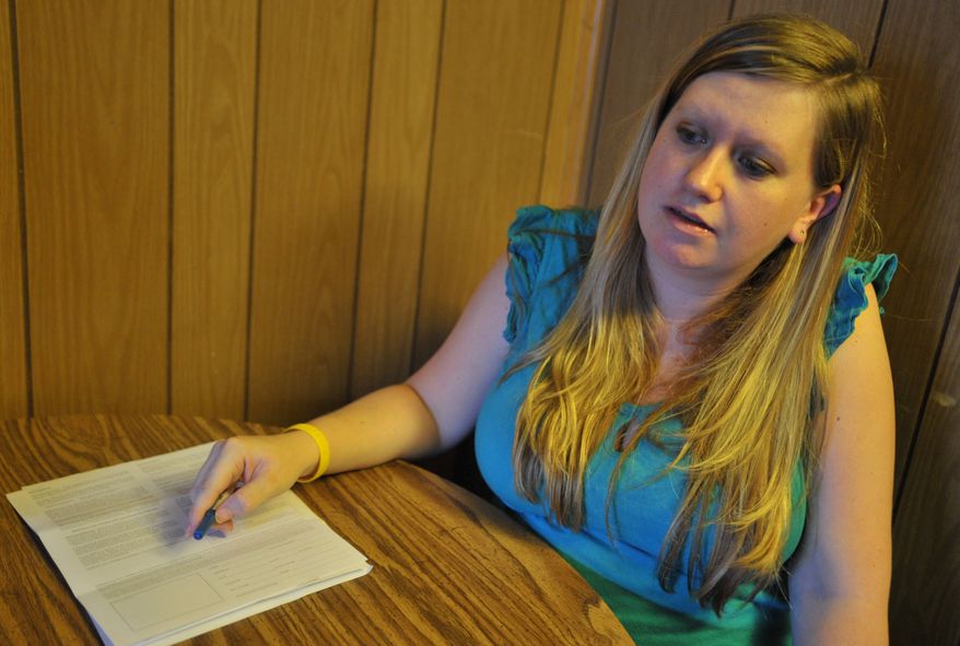 In this photo from Aug. 24, 2011, Denise Williams talks with a reporter in Wilkes-Barre, Pa. Williams entered Monmouth University in New Jersey in 2005, and six years later, the 27-year-old Hanover Township woman struggles to meet even her most basic needs as she deals with the reality of paying off the $45,000 in student debt she amassed. (Associated Press/The Times Leader)