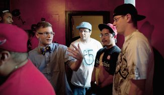 Derek Meitzer, aka D’Meitz (left), freestyles with friends before a rap battle competition at Studio Braat in D.C. By day, the rap artist is Lance Cpl. Meitzer, currently stationed at Marine Corps Base Quantico in Virginia. (Pratik Shah/The Washington Times)