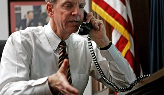 ** FILE ** Rep. Jerry Moran, R- Kan., talks on the phone with constituents in his Capital Hill office Monday, Jan. 29, 2007, in Washington. (AP Photo/Evan Vucci)