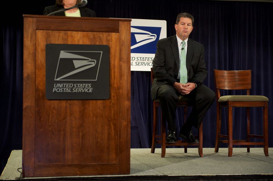 Postmaster General Patrick R. Donahoe (right) is joined by Megan J. Brennan, chief operating officer and executive vice president of the U.S. Postal Service, at a press conference Thursday about proposed sweeping changes needed to avoid losing $10 billion this year. Changes could eliminate 250 mail-processing facilities. (Rod Lamkey Jr./The Washington Times)