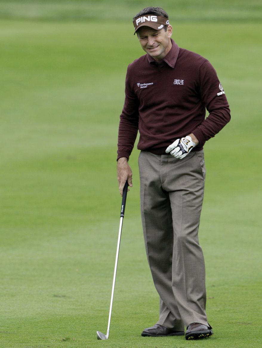 Mark Wilson reacts after his second shot on the 18th hole during the second round at the BMW Championship golf tournament on Friday, Sept. 16, 2011, in Lemont, Ill. (AP Photo/Nam Y. Huh)