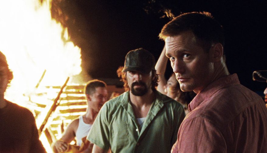 Mississippi stereotypes persist in the remake of "Straw Dogs" with Rhys Coiro (center) and Alexander Skarsgard. (Sony Screen Gems via Associated Press)