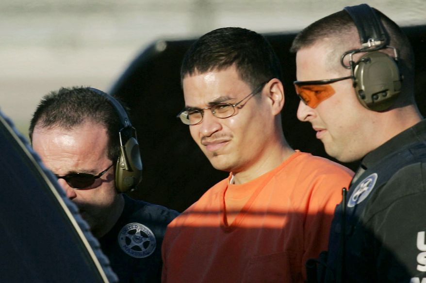 ASSOCIATED PRESS
Jose Padilla is escorted to a waiting police vehicle by federal marshals in 2003. Four years later, he was sentenced to 17 years in prison on terrorism-related charges. On Monday, an appeals court ordered a new sentencing, calling the original term too lenient.