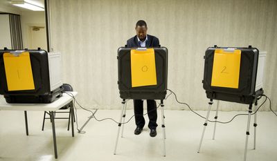 Candidate Derrick Leon Davis votes at the Kettering Baptist Church voting precinct in Upper Marlboro on Tuesday during the 6th District special election in Prince George&#x27;s County to fill Leslie E. Johnson&#x27;s County Council seat. (Rod Lamkey Jr./The Washington Times)