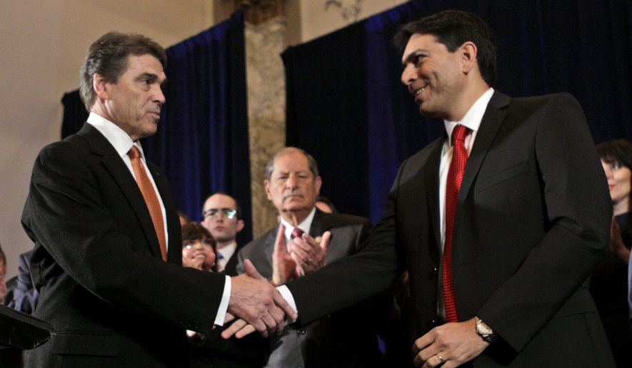 Then-Texas Gov. Rick Perry greets Danny Danon (right), deputy speaker of the Israeli Knesset, as Rep. Robert Turner (center), New York Republican, applauds during a news conference in New York on Tuesday, Sept. 20, 2011. (AP Photo/Mary Altaffer) ** FILE**