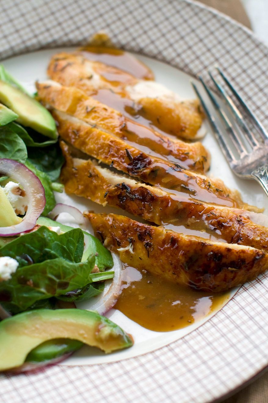 ASSOCIATED PRESS
Honey-thyme glazed chicken is paired with cider gravy and baby spinach salad .The recipe has a sweet autumnal flavor that can be tailored to the preparer's region by using a local wildflower honey and a cider made with heirloom apples.