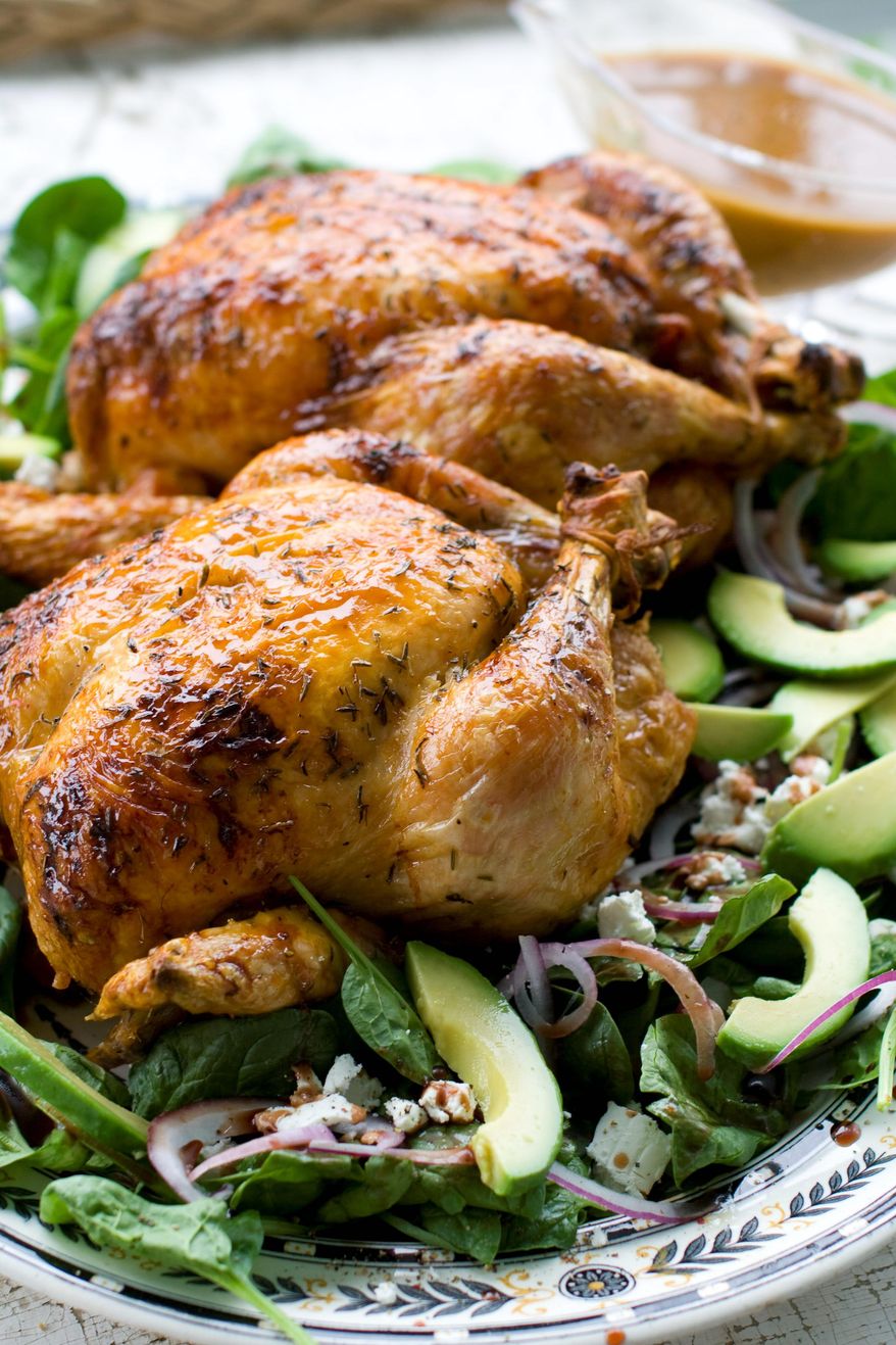 ASSOCIATED PRESS
Honey-thyme glazed chicken is paired with cider gravy and baby spinach salad .The recipe has a sweet autumnal flavor that can be tailored to the preparer's region by using a local wildflower honey and a cider made with heirloom apples.
