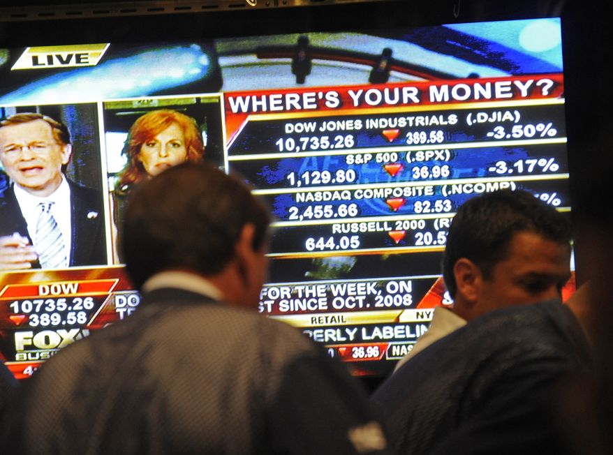 The screen on the floor of the New York Stock Exchange at the closing bell reflects a DOW loss of 389.56 points on Sept. 22, 2011, in New York. (Associated Press)