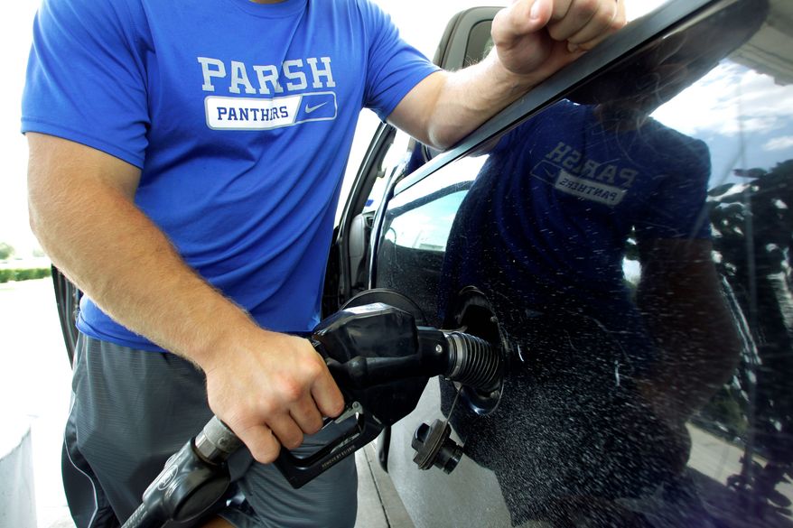 The national average for regular unleaded gasoline is $3.51 per gallon, down from a high of $3.98 in early May. Last week's plunge in oil prices could push the average to $3.25 per gallon by November, analysts say. (Associated Press)