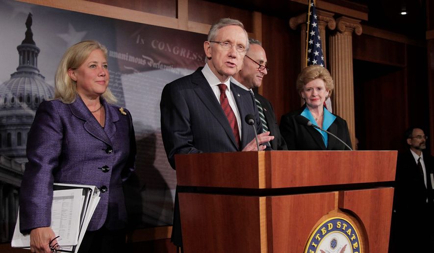 Senate Majority Leader Harry Reid, Nevada Democrat, is joined by fellow Democrats (from left) Sens. Mary L. Landrieu of Louisiana, Chuck Schumer of New York and Debbie Stabenow of Michigan after Monday&#x27;s vote on a short-term funding bill. (Associated Press)