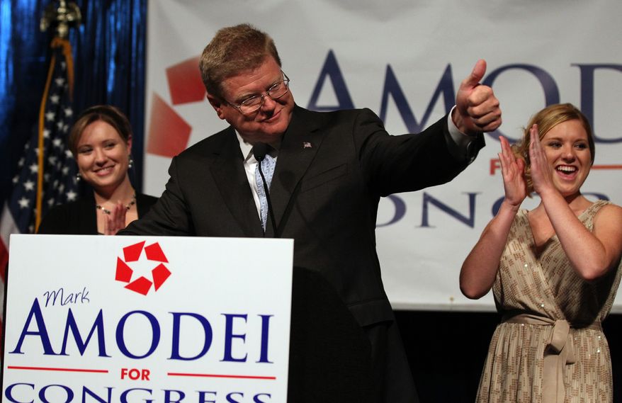 Mark Amodei speaks at a victory party in Reno, Nev., on Sept. 13, 2011, after defeating Democrat Kate Marshall in a special election for Nevada's 2nd Congressional District. Amodei's daughters Erin (left) and Ryanne were among the supporters on hand. (Associated Press)