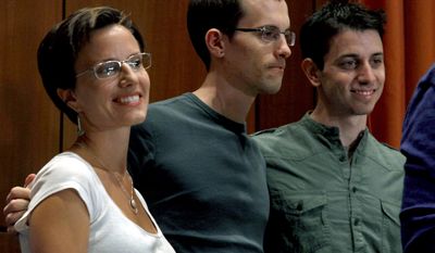 ** FILE ** Sarah Shourd (left), Shane Bauer (center) and Josh Fattal stand together after a news conference in New York on Sept. 25, 2011. Fattal and Bauer, both 29, were held for more than two years in an Iranian prison before being freed last week under a $1 million bail deal. Fellow hiker Shourd was released from the prison last year. (Associated Press)