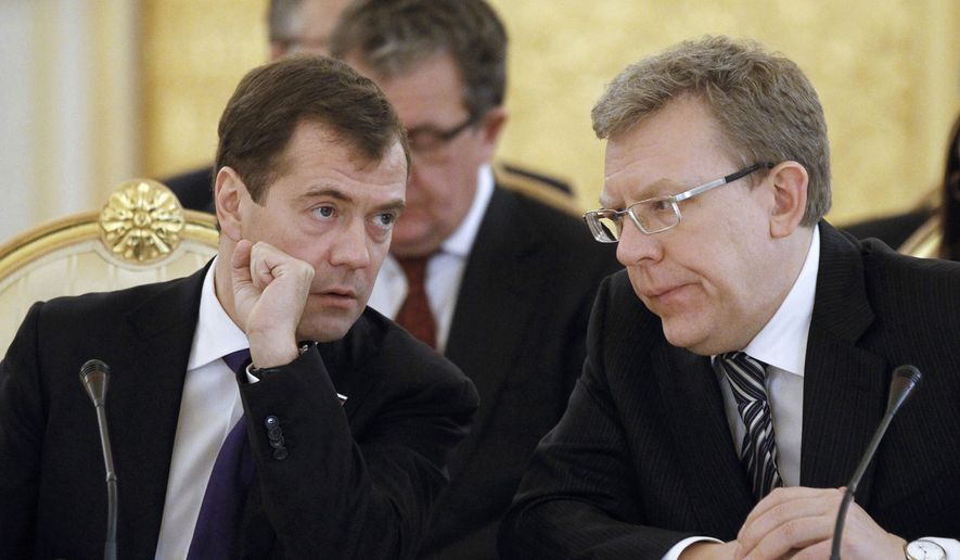 ** FILE ** Russian President Dmitry Medvedev (left) and Finance Minister Alexei Kudrin attend a meeting of the Eurasian Economic Community Interstate Council in Moscow in December 2010. (AP Photo/RIA Novosti, Dmitry Astakhov, Presidential Press Service, File)