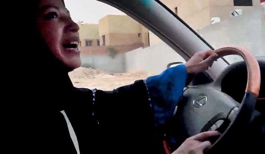 A Saudi Arabian woman drives a car in Riyadh as part of a campaign to defy the kingdom's prohibition on women behind the wheel. A woman in her 30s was sentenced Tuesday to 10 lashes for violating the ban. (Associated Press)