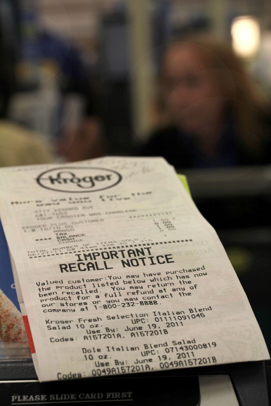 ** FILE ** In this June 27, 2011, photo, a Kroger store receipt with a food recall notice on it sits near a check out lane at a Cincinnati Kroger. Tyson Fresh Meats Inc. is recalling about 131,300 pounds of ground beef that might be contaminated with E. coli, the U.S. Department of Agriculture reported Wednesday, Sept. 28, 2011. (AP Photo/Tom Uhlman)