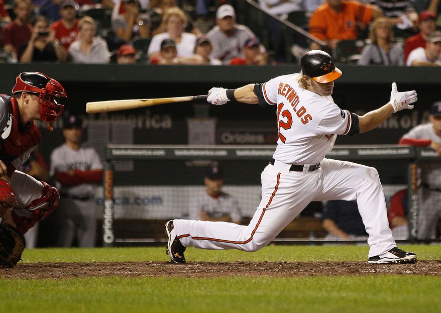 Baltimore Orioles third baseman Mark Reynolds strikes out swinging in the eighth inning of a baseball game against the Boston Red Sox on Tuesday, Sept. 27, 2011, in Baltimore. Reynolds was 0 for 3. Boston won 8-7. (AP Photo/Patrick Semansky)