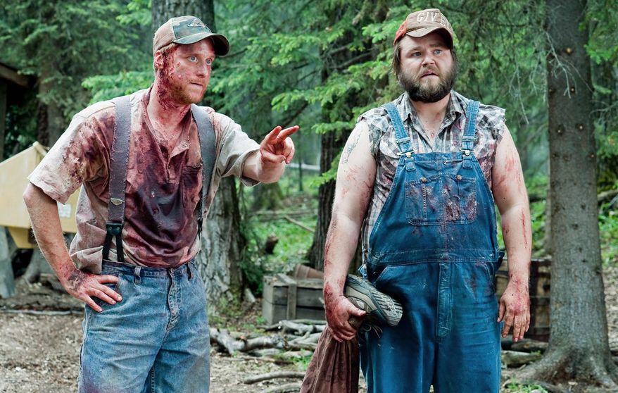 Alan Tudyk (left) and Tyler Labine star in "Tucker & Dale vs. Evil." It's part grisly, low-budget horror spoof, part loopy, role-reversing comedy. (Dan Powers)