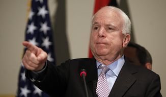 Sen. John McCain, Arizona Republican, speaks to reporters during a visit to Tripoli, Libya, on Thursday, Sept. 29, 2011. (AP Photo/Abdel Magid al-Fergany)
