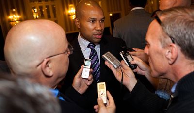 Derek Fisher, center, Los Angeles Lakers point guard and president of the NBA Players Association, speaks to reporters after a five-hour meeting with owners to discuss a new labor deal and possibly avert a lockout on Friday, Sept. 30, 2011, in New York. (AP Photo/John Minchillo)