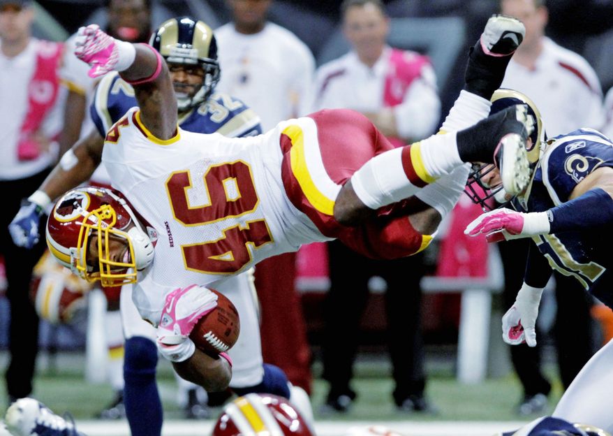 Redskins running back Ryan Torain goes airborne during the third quarter for seven of his 135 yards. His biggest play was a 20-yard touchdown run. (Associated Press)