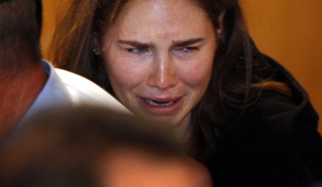 Amanda Knox breaks into tears Oct. 3, 2011, at the Perugia court in central Italy after hearing the verdict that overturned her 2009 conviction of murdering her British roommate. (Associated Press)