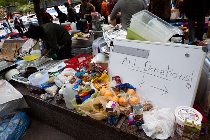 Donated food piles up Oct. 2, 2011, in the kitchen area at the Occupy Wall Street rally in Zuccotti Park, a plaza near in New York City's financial center. (Associated Press)