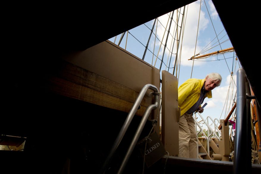 David Laurent Giles of London, England, peers down below deck of the Godspeed. (Andrew Harnik / The Washington Times)