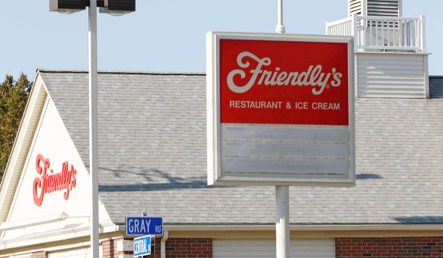 A boy walks past Friendly's in Foxborough, Mass., on Wednesday. The parent of the Massachusetts-based restaurant chain filed for Chapter 11 bankruptcy protection on Wednesday. (Associated Press)
