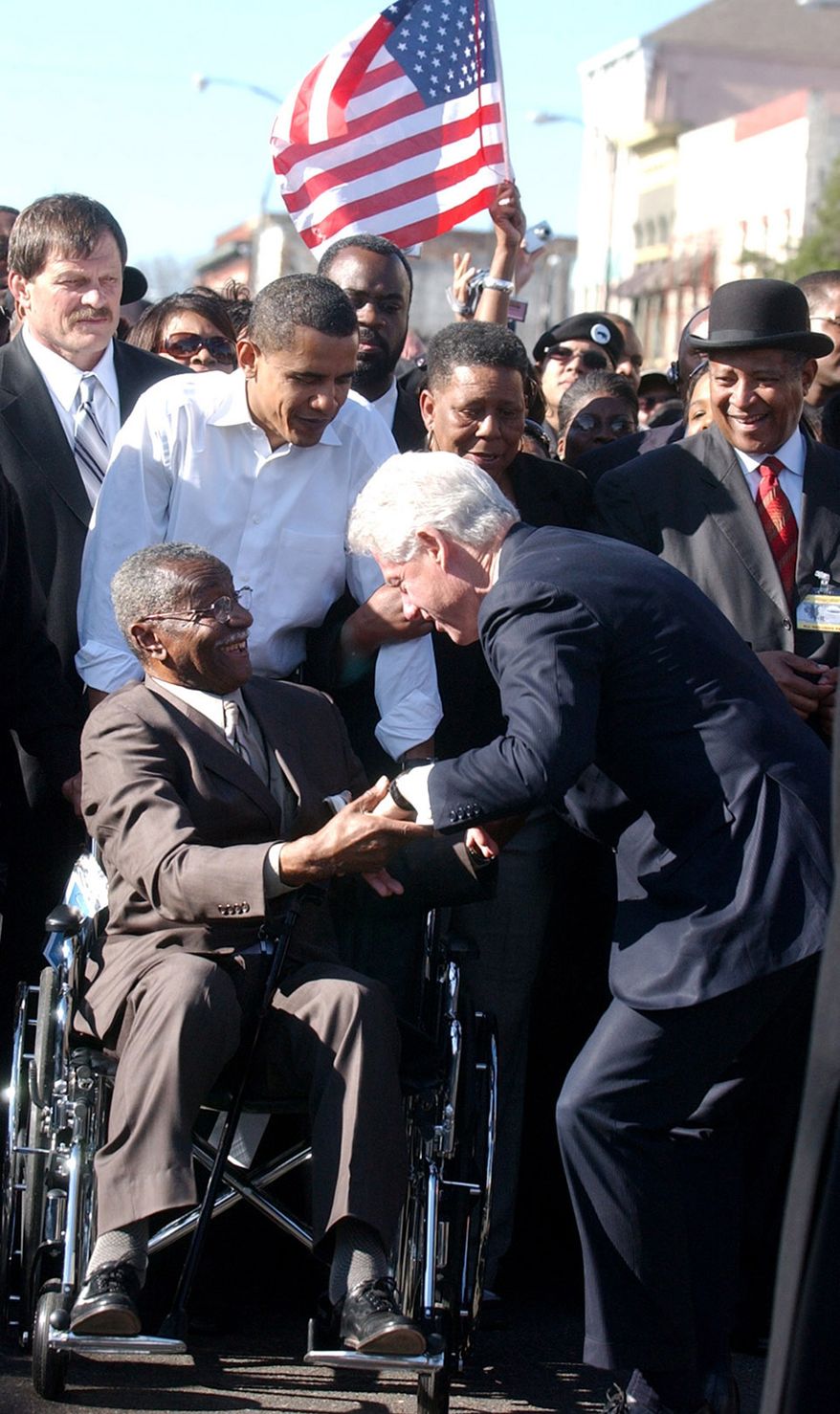 ** FILE ** Then-Sen. Barack Obama (second from left) looks on as the Rev. Fred L. Shuttlesworth (in wheelchair) greets former President Bill Clinton in Selma, Ala., in March 2007. (AP Photo/The Birmingham News, Linda Stelter)