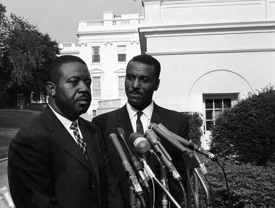 ** FILE ** The Rev. Ralph Abernathy (left) of the Southern Christian Leadership Conference in Atlanta and the Rev. Fred Shuttlesworth of the Revelation Baptist Church in Cincinnati talk to reporters at the White House in Washington after a conference with President Kennedy in 1963. (AP Photo/Bill Allen, File)