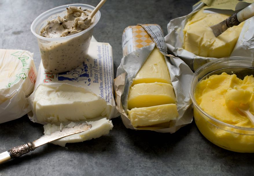 From left to right, Sea Salted Butter France, Black Truffle butter, top, Butter of Parma Italy, bottom, Vermont Cultured butter, Buerre d'Isigny France, top right, and Brookford Farm Uncultured butter in Concord, N.H. (Associated Press)