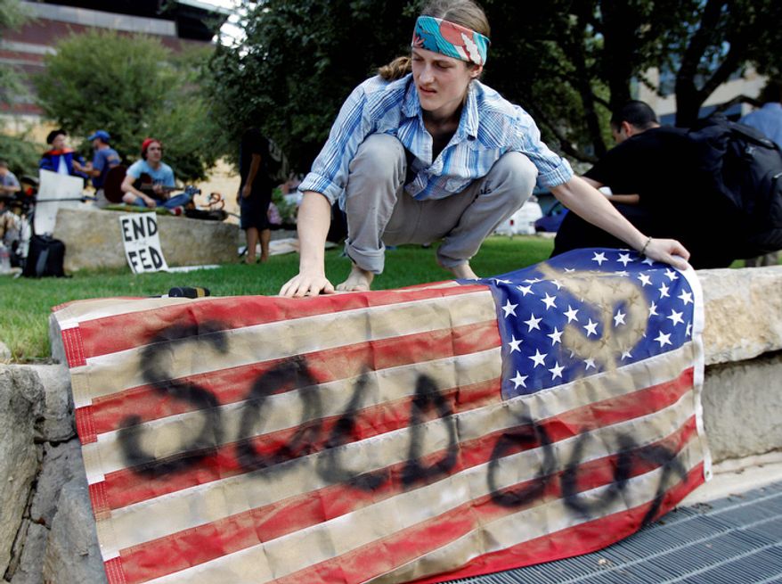 Brighton Wallace takes part in an "Occupy Austin" protest at Austin City Hall, Thursday, Oct. 6, 2011, in Austin, Texas. (AP Photo/Eric Gay)