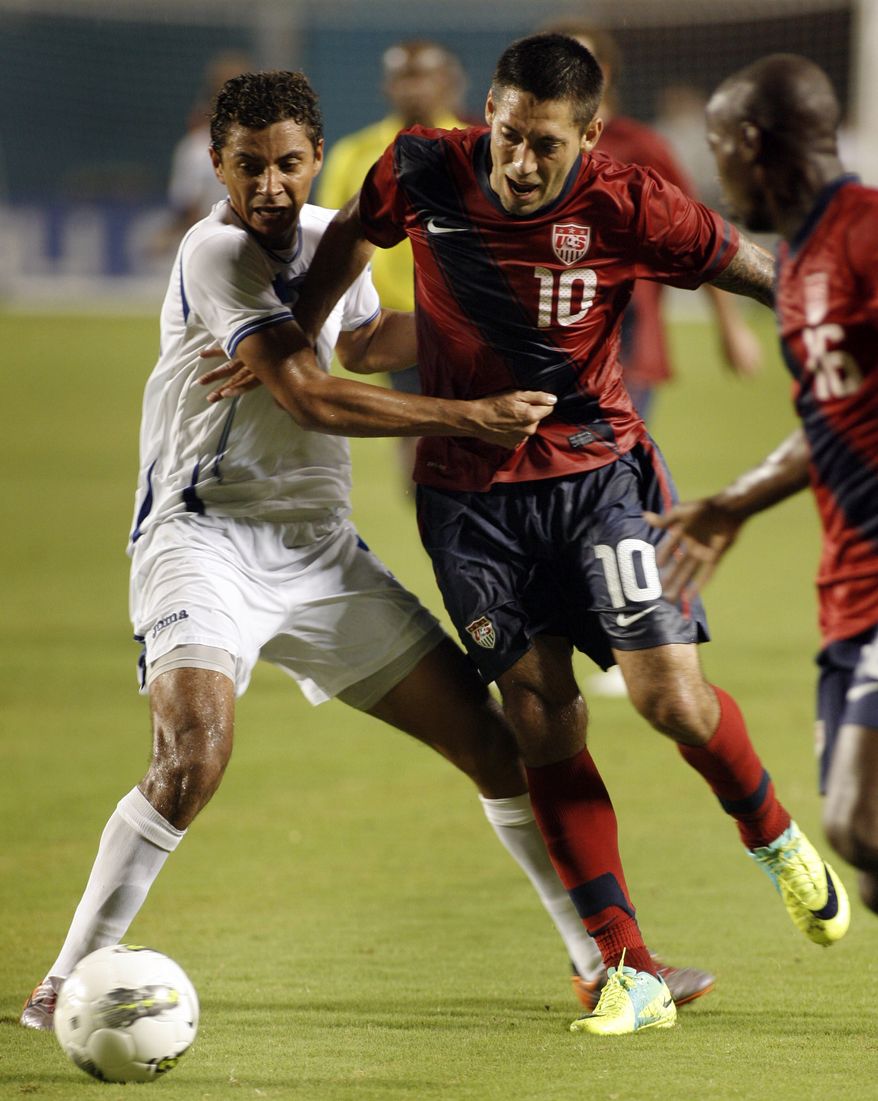 United States' Clint Dempsey, right, fights for the ball with Honduras' Mauricio Sabillon left, during the second half of an international friendly soccer game in Miami, Fla. Saturday Oct. 8, 2011. Dempsey scored the only goal of the game in the USA's 1-0 win. (AP Photo/Jeffrey M. Boan)