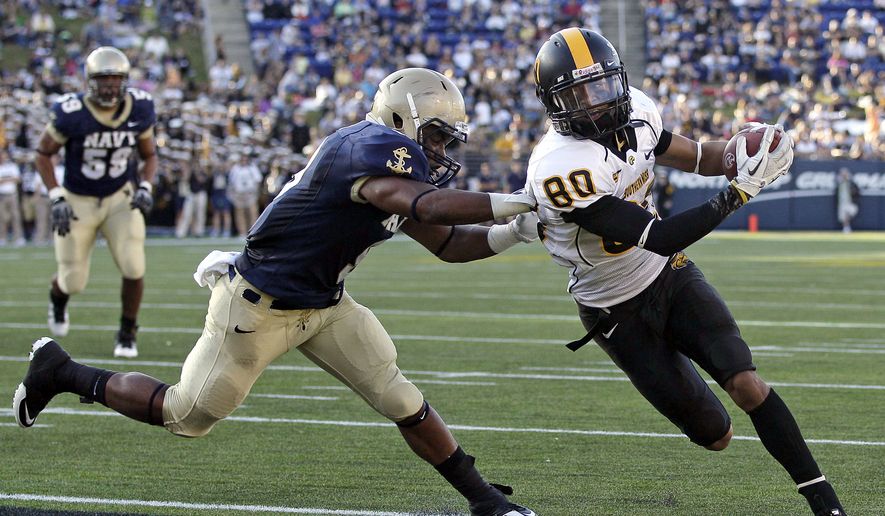 Southern Miss wide receiver Ryan Balentine, runs past Navy safety Tra&#39;ves Bush for a touchdown in the first half of an NCAA college football game in Annapolis, Md., Saturday, Oct. 8, 2011. (AP Photo/Patrick Semansky)