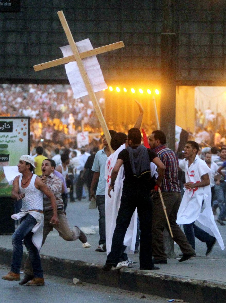 Clashes erupt Sunday at a protest of a recent attack on a church in Cairo. After midnight, mobs roamed downtown streets, attacking cars they suspected had Christian passengers. In many areas, there was no visible police or army presence to confront or stop them. (Associated Press)