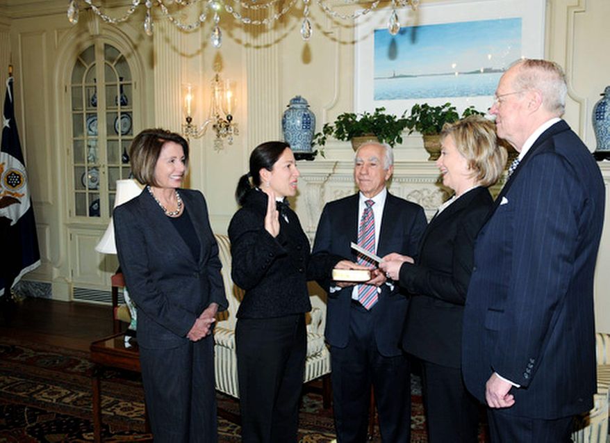Eleni Tsakopoulos-Kounalakis, longtime friend of House Speaker Nancy Pelosi (left), was sworn in as ambassador to Hungary in January, 2010 by Secretary of State Hillary Rodham Clinton (second from right). Also in attendance were her father, Angelo Tsakopoulos, (holding Bible) and Supreme Court Justice Anthony Kennedy. Mrs. Pelosi's husband, Paul, is a longtime business associate of Mr. Tsakopoulos. (State Department)