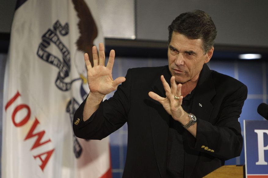 Texas Gov. Rick Perry speaks Oct. 7, 2011, during the Johnson County GOP Fall BBQ at Clear Creek-Amana High School in Tiffin, Iowa. (Associated Press)