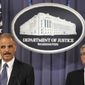 Attorney General Eric H. Holder Jr. (left), accompanied by FBI Director Robert S. Mueller III, announces on Tuesday, Oct. 11, 2011, in Washington that two men have been charged in an alleged plot directed by elements of the Iranian government to murder the Saudi ambassador to the United States. (AP Photo/Haraz N. Ghanbari)