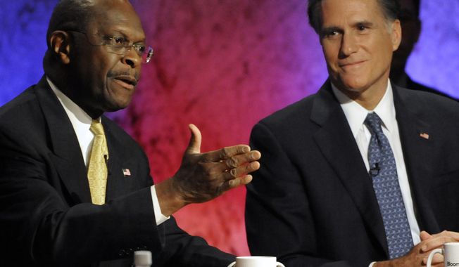 Republican presidential candidate Herman Cain speaks Tuesday night as former Massachusetts Gov. Mitt Romney listens during a GOP debate at Dartmouth College in Hanover, N.H. (Associated Press)